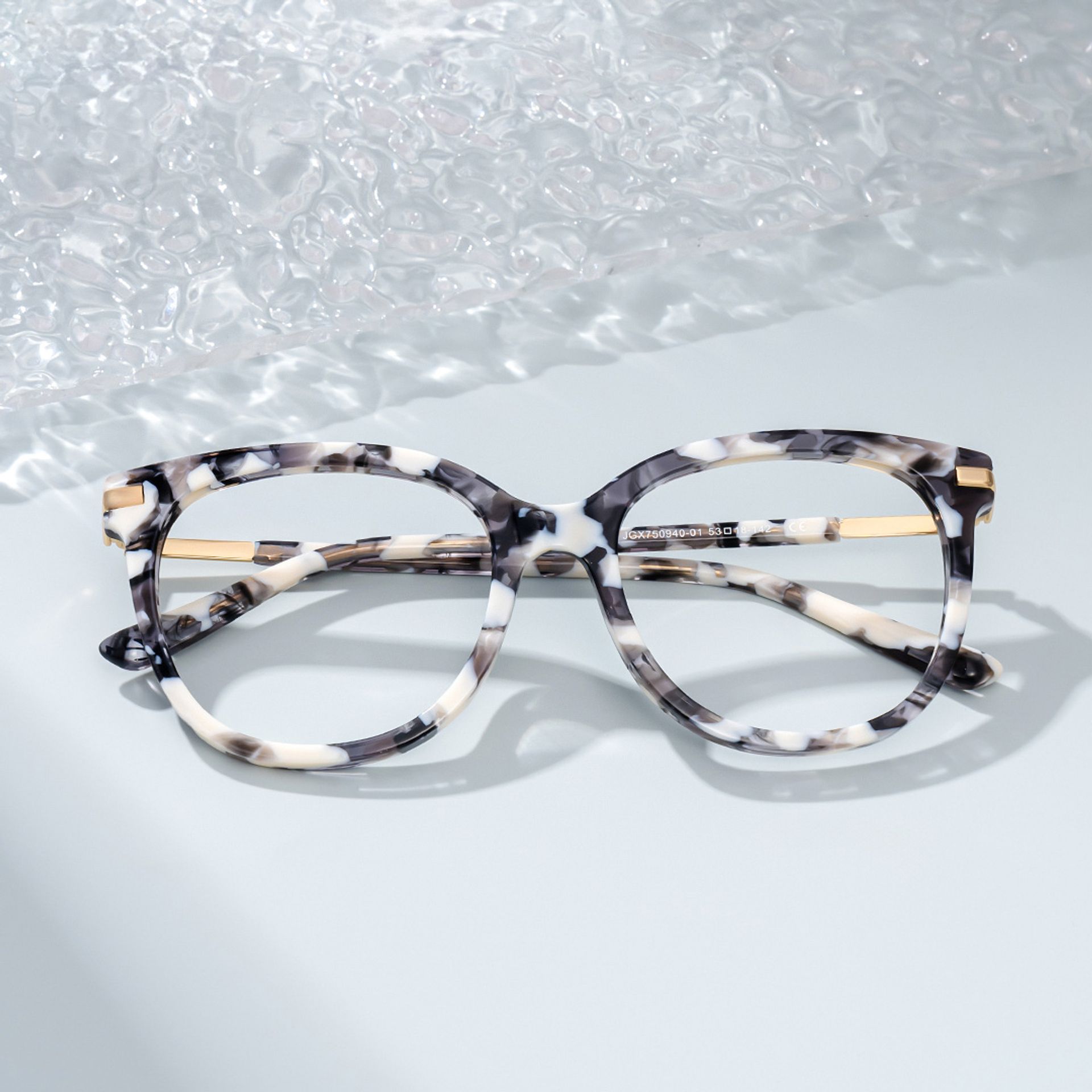 Round Grey Glasses With a Marble Pattern1